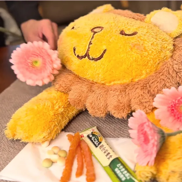 お花とおやつを添えてお見送りする様子